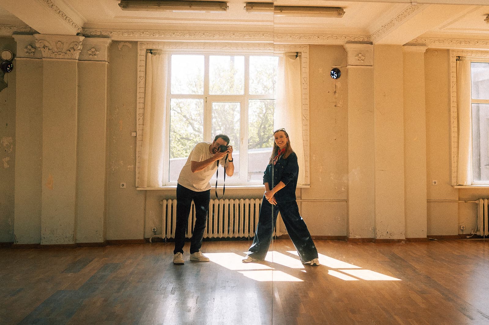 Photographer at work in a sunlit room