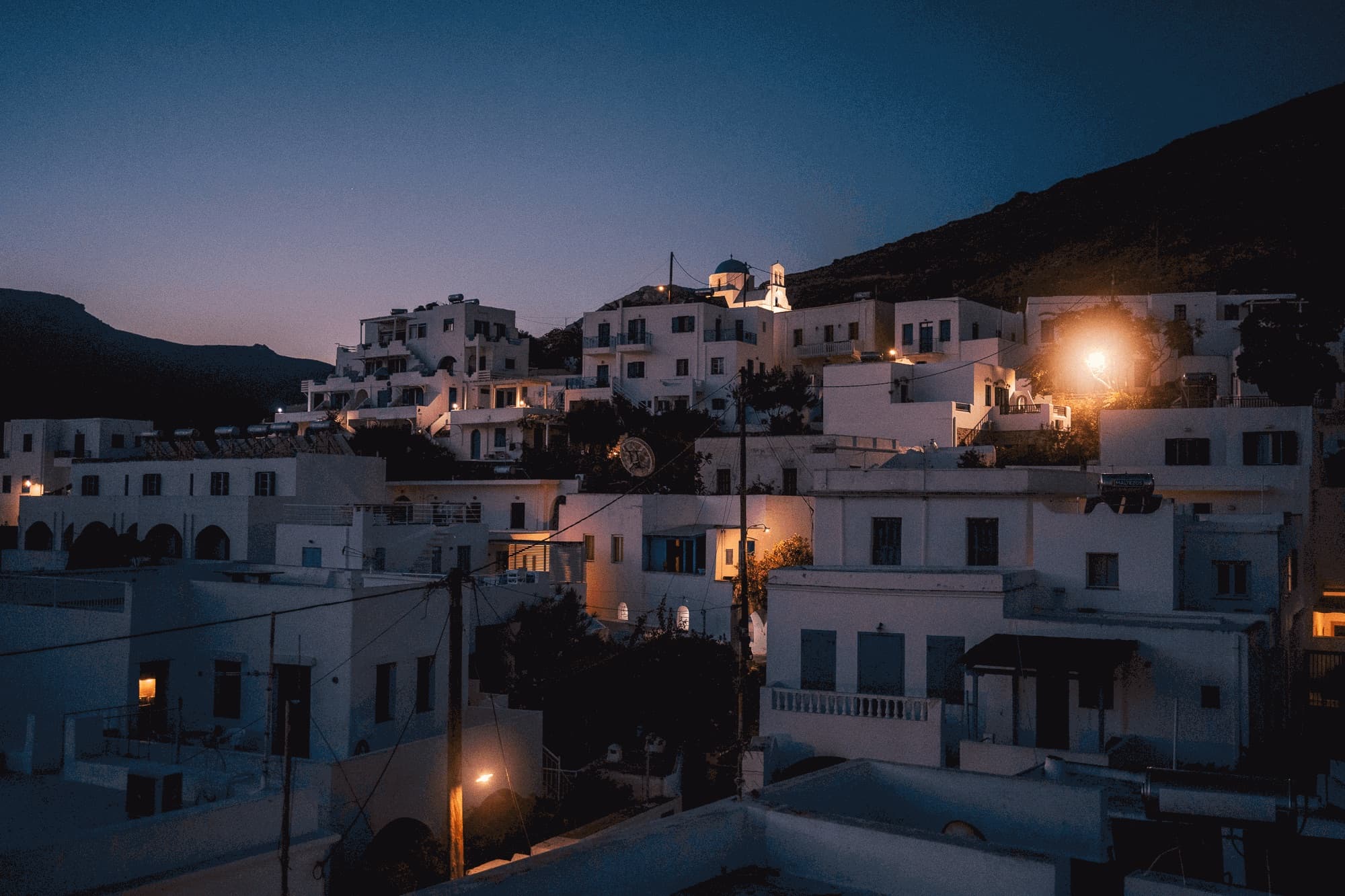 White houses of an island village at dusk